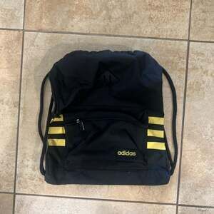 Adidas Drawstring Backpack Sackpack, Black with Gold Stripes - One Size